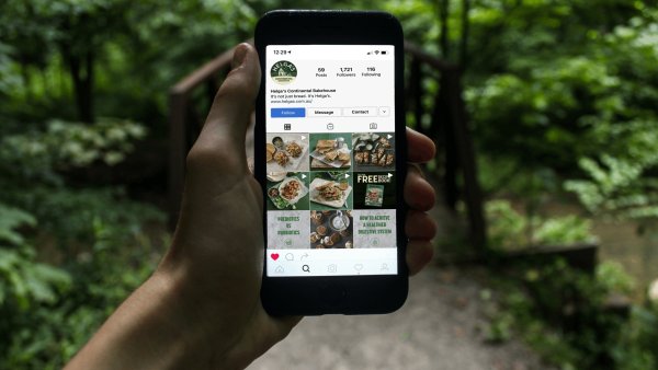 Image of someone holding a phone with Instagram open